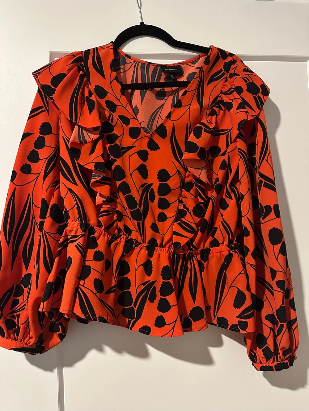 Women’s Orange Ruffle Peplum Blouse with Black Floral Print